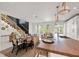 Open-concept kitchen featuring a large island, seating, and modern lighting at 109 Palmetto Ave, Anna Maria, FL 34216