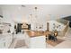 Bright and airy, this kitchen boasts a large island, modern appliances, and stylish fixtures at 109 Palmetto Ave, Anna Maria, FL 34216