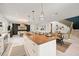 Beautiful open kitchen with wood countertop island and pendant lighting at 109 Palmetto Ave, Anna Maria, FL 34216
