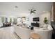 Spacious open floorplan featuring living, dining and kitchen with modern lighting at 109 Palmetto Ave, Anna Maria, FL 34216