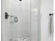Modern shower design with decorative tile, glass door, and sleek black fixtures at 109 Palmetto Ave, Anna Maria, FL 34216