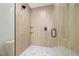 Tile shower featuring glass enclosure, overhead shower head and built-in shelves at 109 Palmetto Ave, Anna Maria, FL 34216