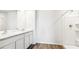 Well-lit bathroom features marble counters, dual sinks, and a stand up shower at 12064 Lansing Gln, Parrish, FL 34219