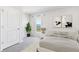 Bright bedroom featuring plush carpeting, neutral decor, and a tranquil lake view at 12064 Lansing Gln, Parrish, FL 34219