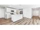 Modern kitchen featuring white cabinets, stainless steel appliances, and center island at 12064 Lansing Gln, Parrish, FL 34219