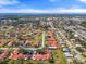 Expansive aerial view of a community with red rooftops and mature trees, near waterfront at 1227 56Th St W # 1227, Bradenton, FL 34209