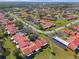 Aerial view of a residential community with red tile roofs and lush landscaping at 1227 56Th St W # 1227, Bradenton, FL 34209