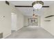 Spacious living room featuring vaulted ceilings, carpet flooring, and sliding glass doors at 1227 56Th St W # 1227, Bradenton, FL 34209