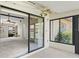 Cozy sunroom with tile flooring, ceiling fan, and views of the backyard at 1227 56Th St W # 1227, Bradenton, FL 34209