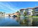 Picturesque waterfront condos, complete with private boat docks and vibrant landscaping at 1250 N Portofino Dr # 208, Sarasota, FL 34242