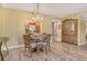 Cozy dining room area adjacent to kitchen, featuring a chandelier and stylish decor at 1250 N Portofino Dr # 208, Sarasota, FL 34242