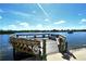 Waterfront community dock offering serene views and access to the beautiful canal at 1250 N Portofino Dr # 208, Sarasota, FL 34242