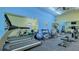 Well-equipped fitness center with treadmills, elliptical machines, weights, and mirrors for a complete workout at 1250 N Portofino Dr # 208, Sarasota, FL 34242