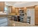 Kitchen featuring granite countertops and stainless steel appliances, with natural light at 1250 N Portofino Dr # 208, Sarasota, FL 34242