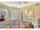 Bedroom with a bright atmosphere, and balcony access with a matching furniture set at 1250 N Portofino Dr # 208, Sarasota, FL 34242