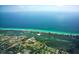 Aerial view of Pine Run, with ocean views, lush green mangroves, and beautiful blue waters at 137 Woodland Pl, Osprey, FL 34229
