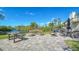 Community outdoor amenity area features a firepit, outdoor seating, grills and serene water views offering an idyllic setting at 137 Woodland Pl, Osprey, FL 34229