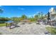 Community outdoor amenity area features a firepit, outdoor seating, grills and serene water views offering an idyllic setting at 137 Woodland Pl, Osprey, FL 34229