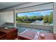 Scenic balcony view overlooking the serene water, a fountain, and lush greenery for a peaceful retreat at 137 Woodland Pl, Osprey, FL 34229