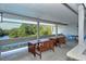 Relaxing balcony with views of the adjacent water and scenic trees providing a peaceful atmosphere at 137 Woodland Pl, Osprey, FL 34229