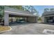 Carport with sports car at 137 Woodland Pl, Osprey, FL 34229