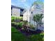 A vibrant garden accentuates the building's exterior, enhancing its curb appeal at 137 Woodland Pl, Osprey, FL 34229
