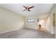 A spacious living area features carpet floors and a ceiling fan at 137 Woodland Pl, Osprey, FL 34229