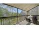 Enjoy nature's beauty on this home's outdoor patio with comfortable seating and views at 137 Woodland Pl, Osprey, FL 34229