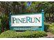 Community sign reading 'Pine Run' with 'No Trespassing or Soliciting' notice at 137 Woodland Pl, Osprey, FL 34229