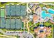 Aerial view of tennis courts, swimming pool and parking in a beautiful community at 16804 Vardon Ter # 307, Bradenton, FL 34211
