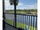 Relaxing balcony with comfortable seating overlooking the tranquil lake and golf course at 16804 Vardon Ter # 307, Bradenton, FL 34211