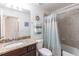 Bathroom features a vanity with granite counters and a shower/tub combo at 16804 Vardon Ter # 307, Bradenton, FL 34211