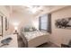 Relaxing bedroom with white bed frame, two nightstands, and natural light at 16804 Vardon Ter # 307, Bradenton, FL 34211
