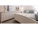 Bright bedroom features a dresser, a table, and coastal-themed decor at 16804 Vardon Ter # 307, Bradenton, FL 34211