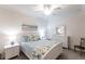 Calm bedroom featuring a white bed frame, two nightstands, and dresser at 16804 Vardon Ter # 307, Bradenton, FL 34211