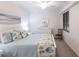 Bright bedroom features a ceiling fan, large window, and coastal-themed decor at 16804 Vardon Ter # 307, Bradenton, FL 34211