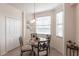 Bright breakfast nook featuring a glass table, four chairs, and natural light at 16804 Vardon Ter # 307, Bradenton, FL 34211