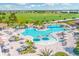 Aerial view of the community pool with waterfalls, lounge chairs, and ample seating at 16804 Vardon Ter # 307, Bradenton, FL 34211