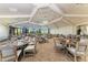 Spacious dining room with tray ceilings and ample seating for large gatherings at 16804 Vardon Ter # 307, Bradenton, FL 34211