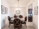 Lovely dining area features a glass table set, perfect for Gathering gatherings and meals at 16804 Vardon Ter # 307, Bradenton, FL 34211