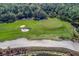 Scenic aerial view of the golf course with sand traps and manicured green at 16804 Vardon Ter # 307, Bradenton, FL 34211