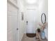 Bright entryway with neutral walls, decorative mirror and convenient coat closet at 16804 Vardon Ter # 307, Bradenton, FL 34211