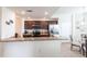 Bright kitchen featuring granite countertops, stainless steel appliances, and wood cabinetry at 16804 Vardon Ter # 307, Bradenton, FL 34211