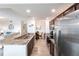 Spacious kitchen with granite countertops, stainless steel appliances, and views to living areas at 16804 Vardon Ter # 307, Bradenton, FL 34211