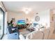 Spacious living room with ceiling fan, TV, and cozy seating, perfect for relaxing at 16804 Vardon Ter # 307, Bradenton, FL 34211