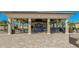 A large, covered outdoor area with a bar, seating, and ample open space for events and gatherings at 16804 Vardon Ter # 307, Bradenton, FL 34211