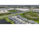 A planned community near a roadway and waterway showcases modern homes and lush green spaces at 17632 Santorini Ct, Venice, FL 34293