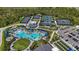 Aerial view of the community amenities including pool, tennis courts, and bocce ball at 17632 Santorini Ct, Venice, FL 34293