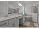 Modern bathroom with double sinks, and a relaxing soaking tub at 17632 Santorini Ct, Venice, FL 34293