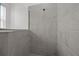 Close up of a luxurious walk-in shower with modern tiling at 17632 Santorini Ct, Venice, FL 34293